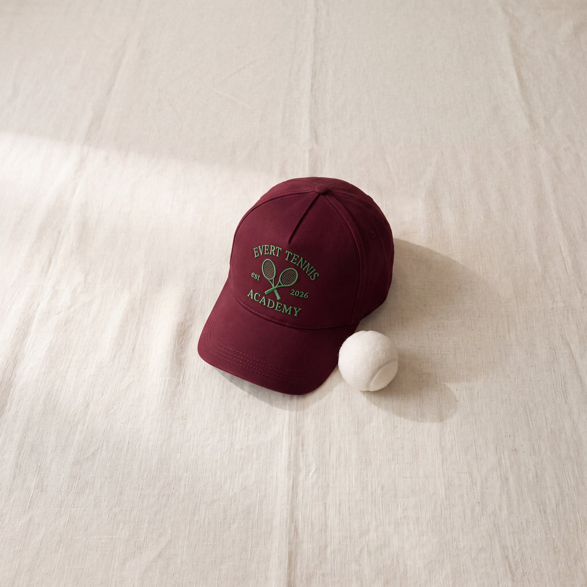 Custom embroidered baseball cap, burgundy tennis academy design — Eddia