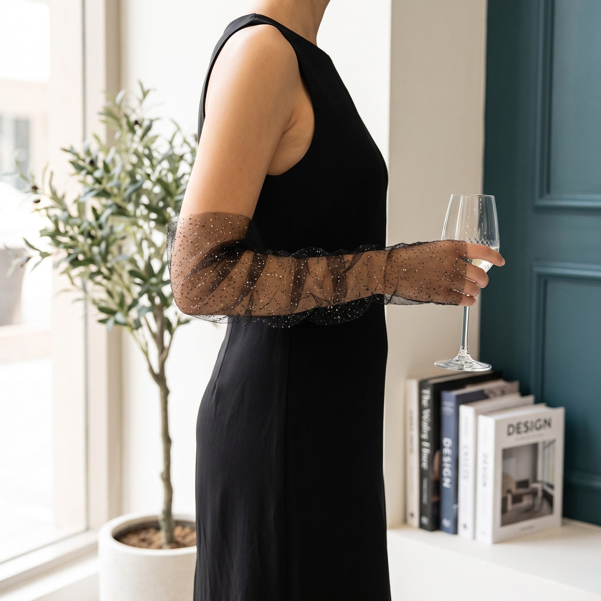 Ruched black tulle arm cuffs flecked with fine glitter, fingerless, ruffle edge.