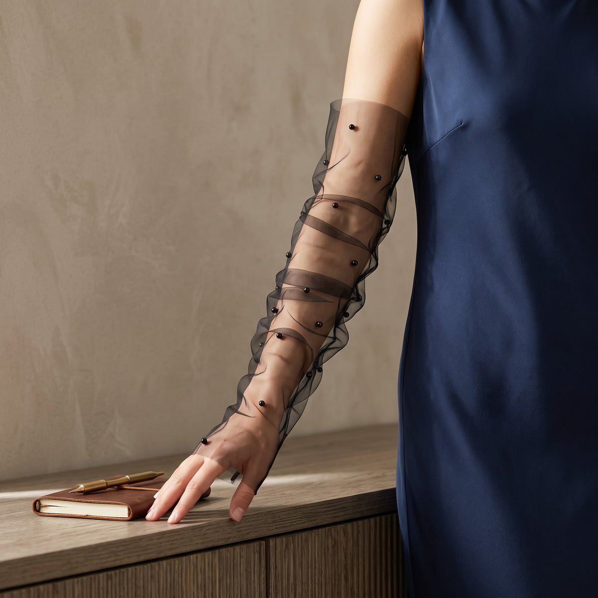 Black tulle arm cuffs scattered with black pearls, fingerless, ruched.