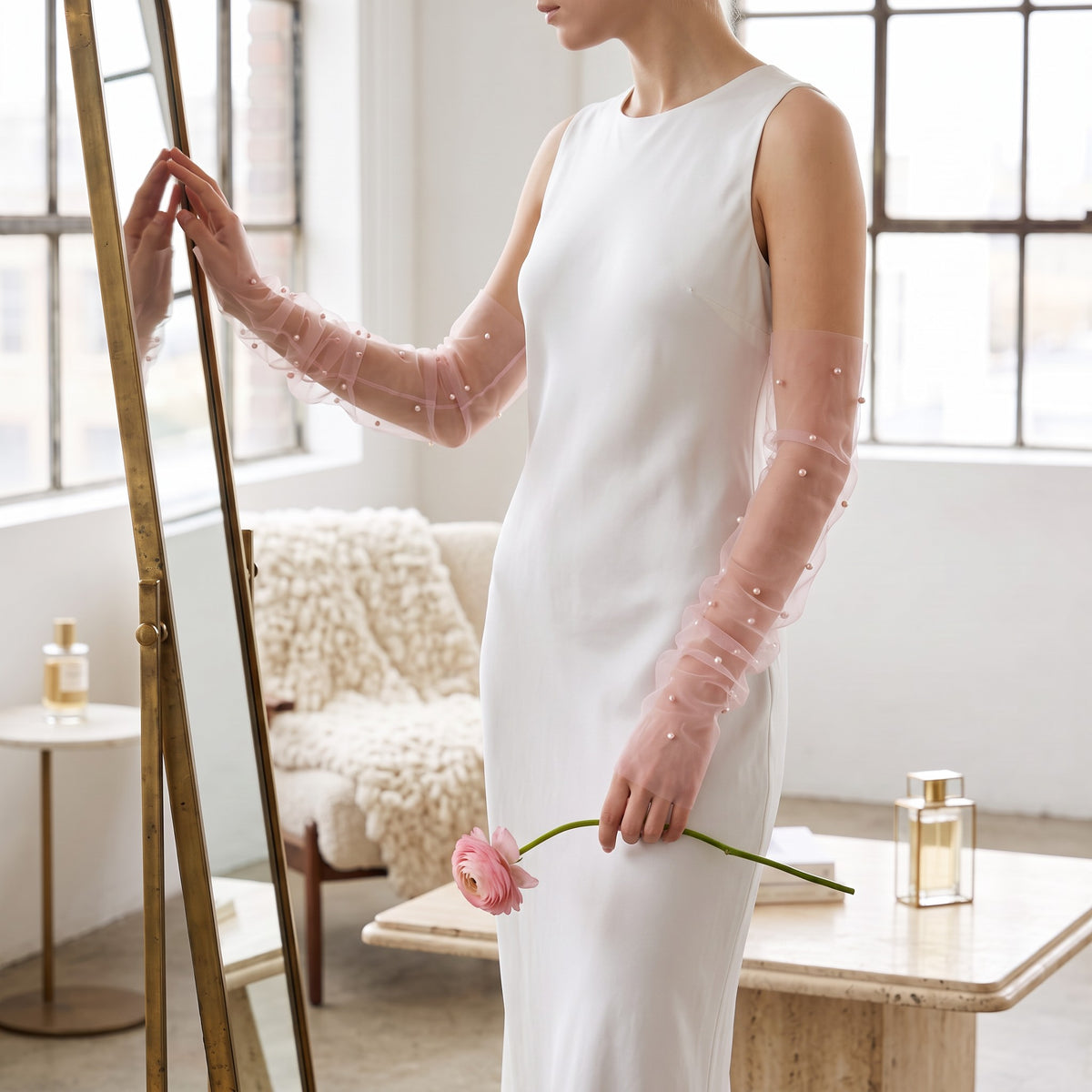 White tulle arm cuffs set with larger pearls, fingerless, densely ruched.