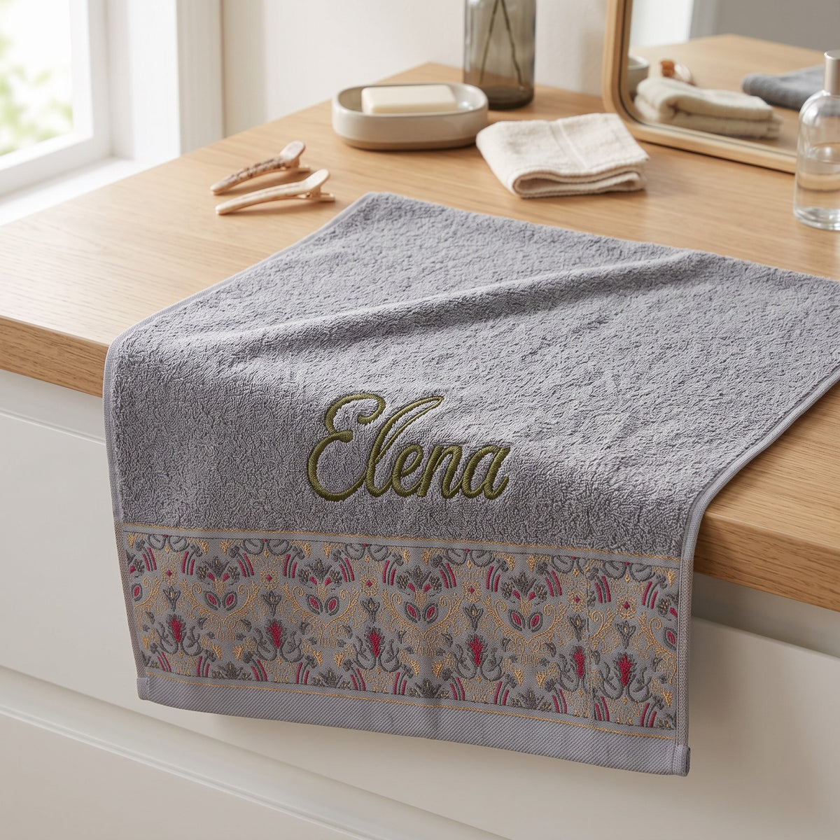 Elena personalized hair towel, olive green script embroidery on light gray cotton with a patterned border — photo 3