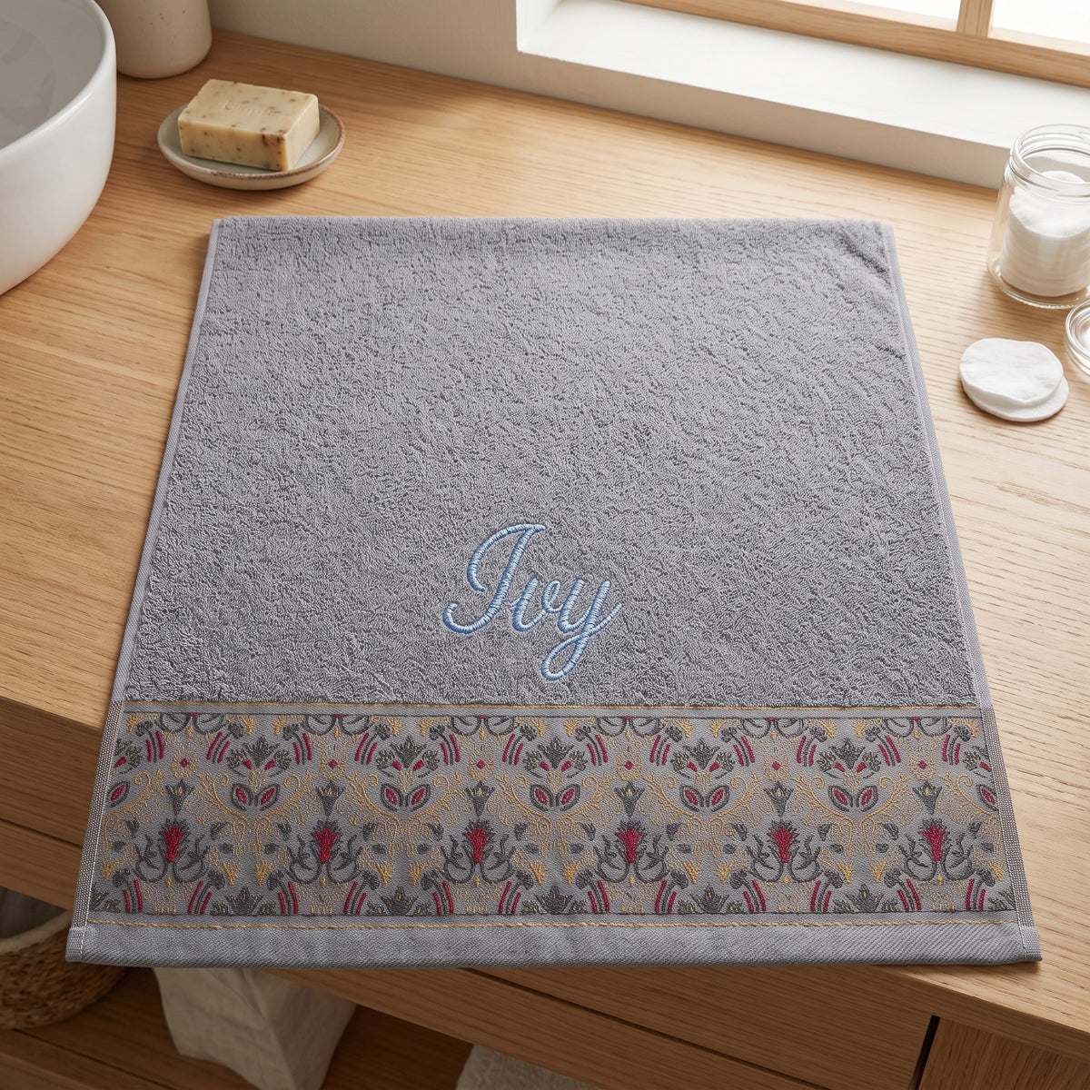 Ivy personalized hair towel, light blue script embroidery on light gray cotton with a patterned border — photo 3