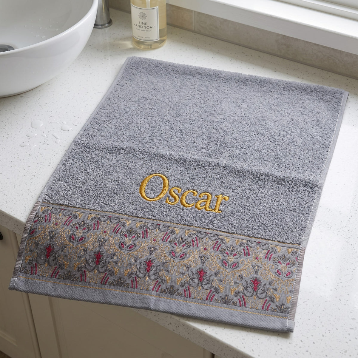 Oscar personalized hair towel, gold serif embroidery on light gray cotton with a patterned border — photo 3