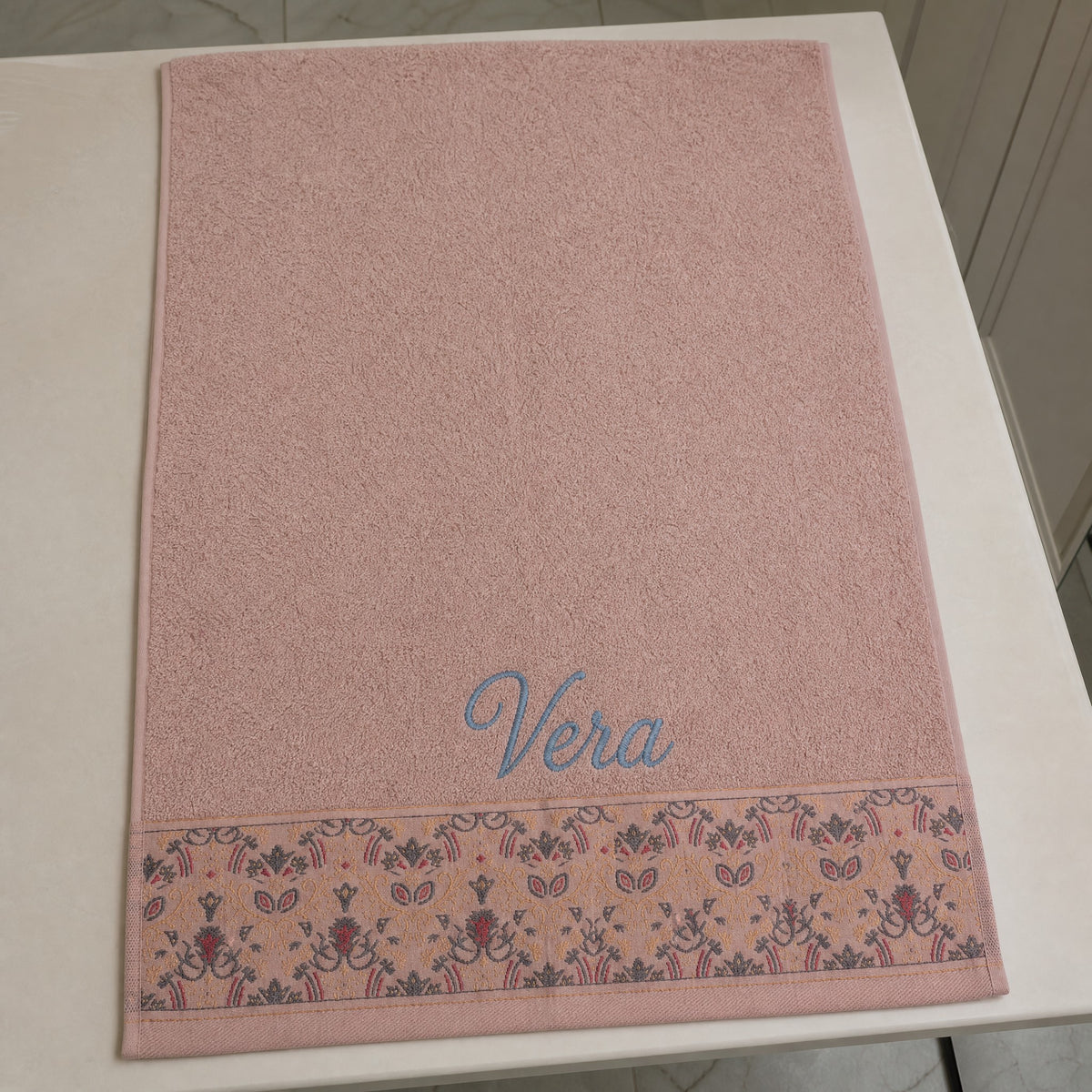 Vera personalized hair towel, blue script embroidery on blush pink cotton with a patterned border — photo 3