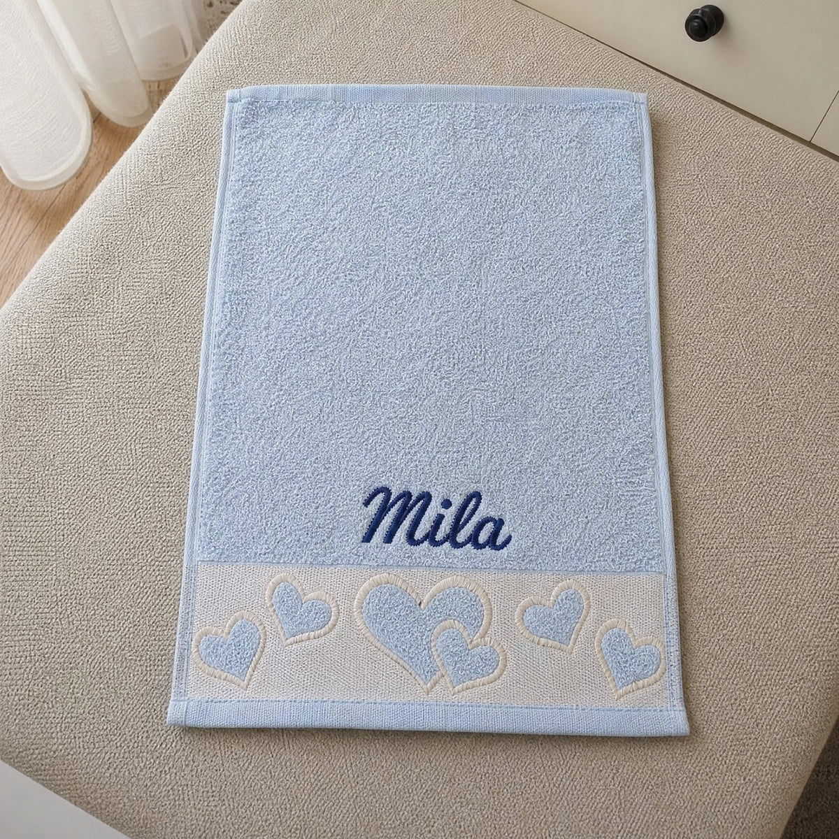 Mila personalized heart hand towel, navy script embroidery on baby blue cotton — photo 5