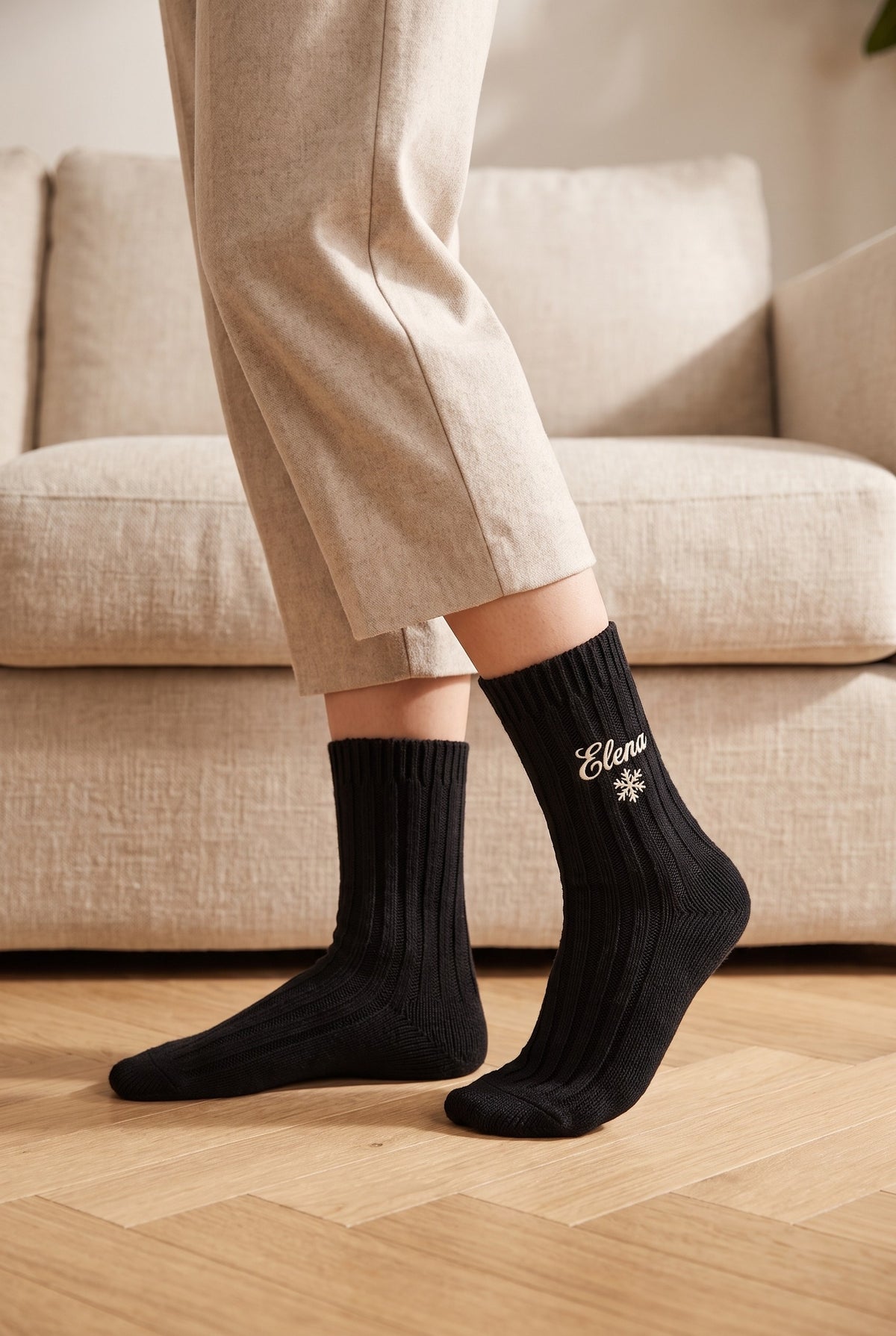 Model wearing black embroidered women's wool socks, second view