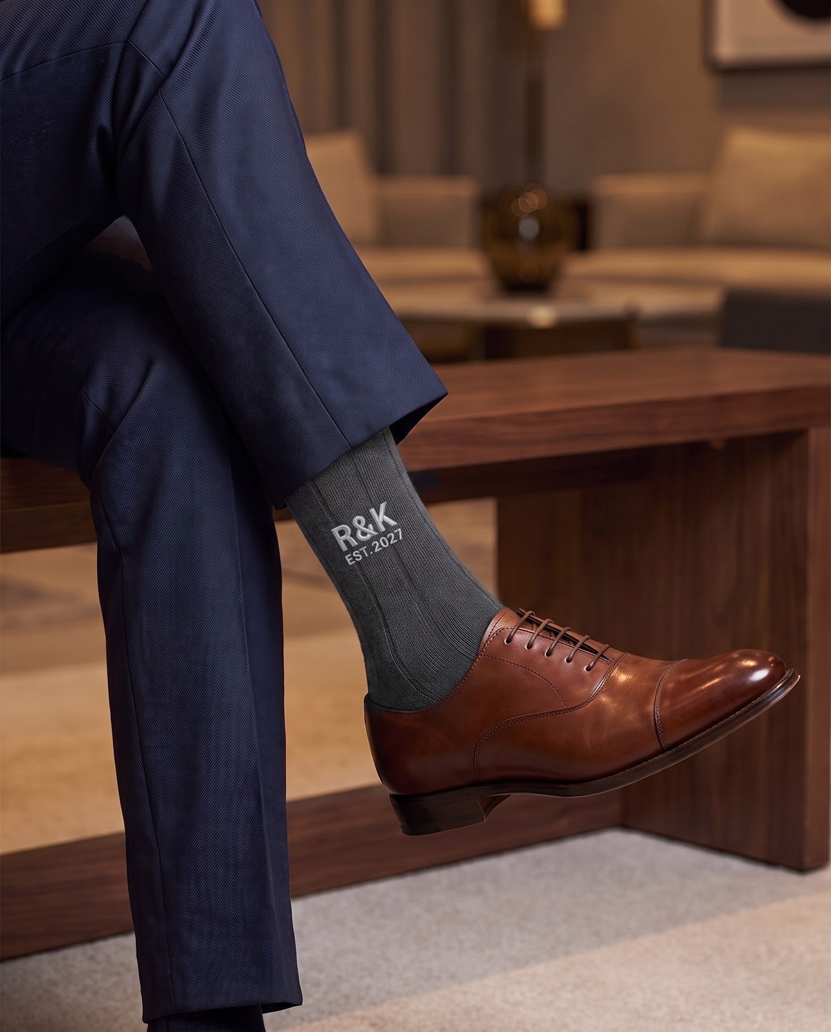 Model wearing charcoal embroidered groom dress socks