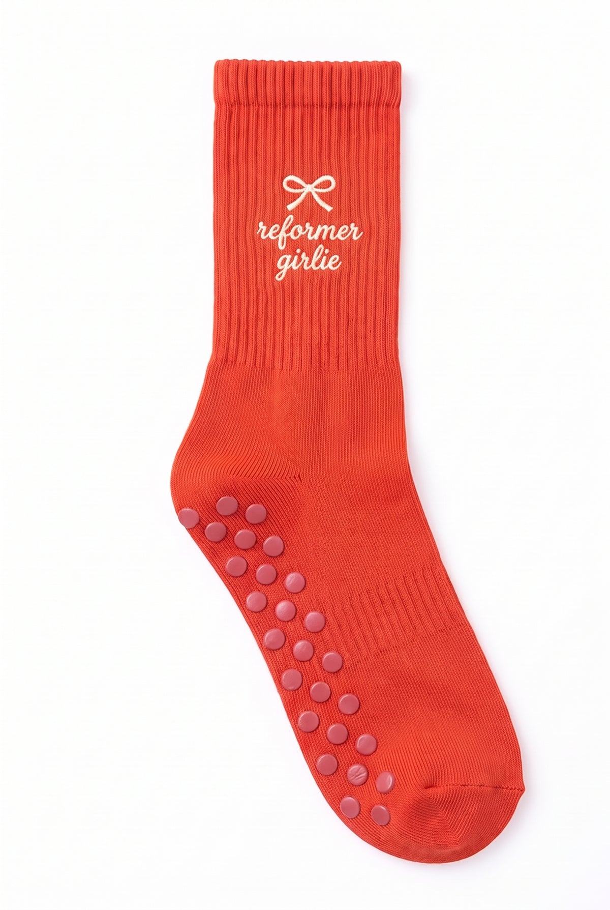 Orange dot grip pilates socks with custom embroidery on the cuff