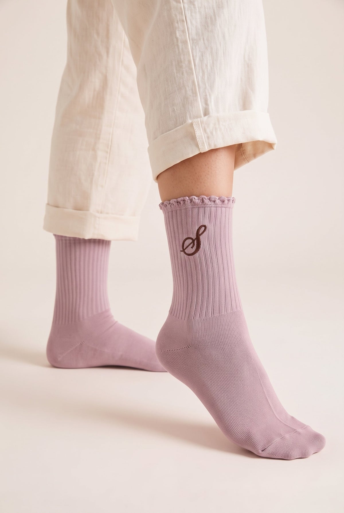 Powder personalized embroidered ruffle socks, worn, second angle — made to order