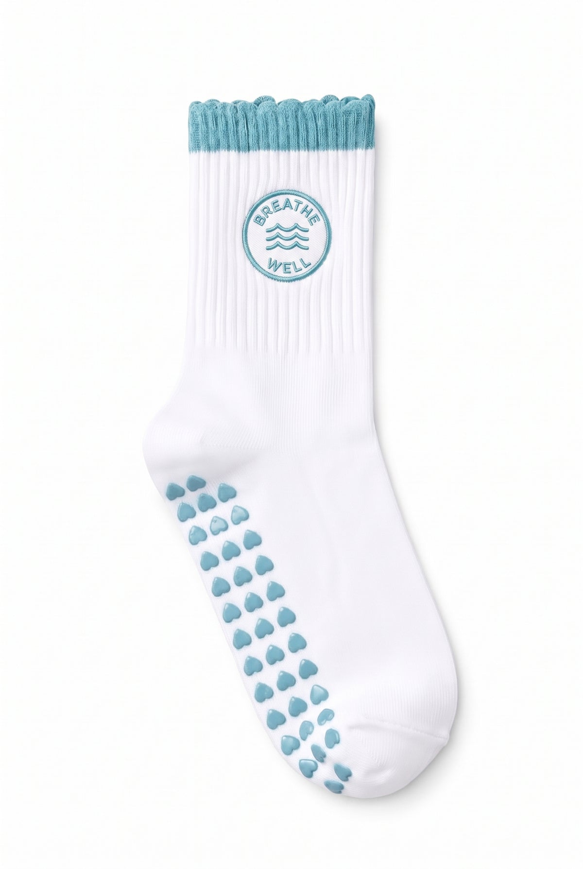 Turquoise ruffle pilates grip socks, close-up of the custom embroidery on the ankle — embroidered to order