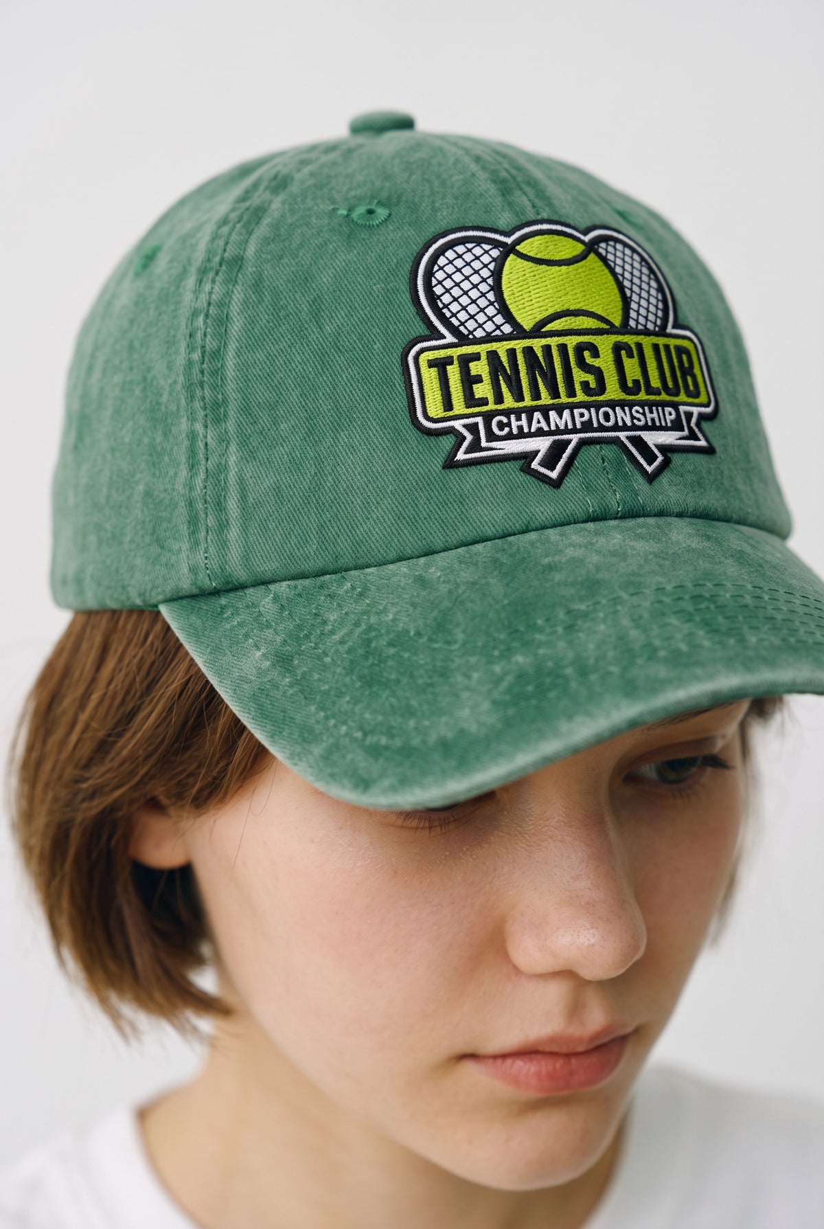 Tennis Club Hat worn by a model, front view
