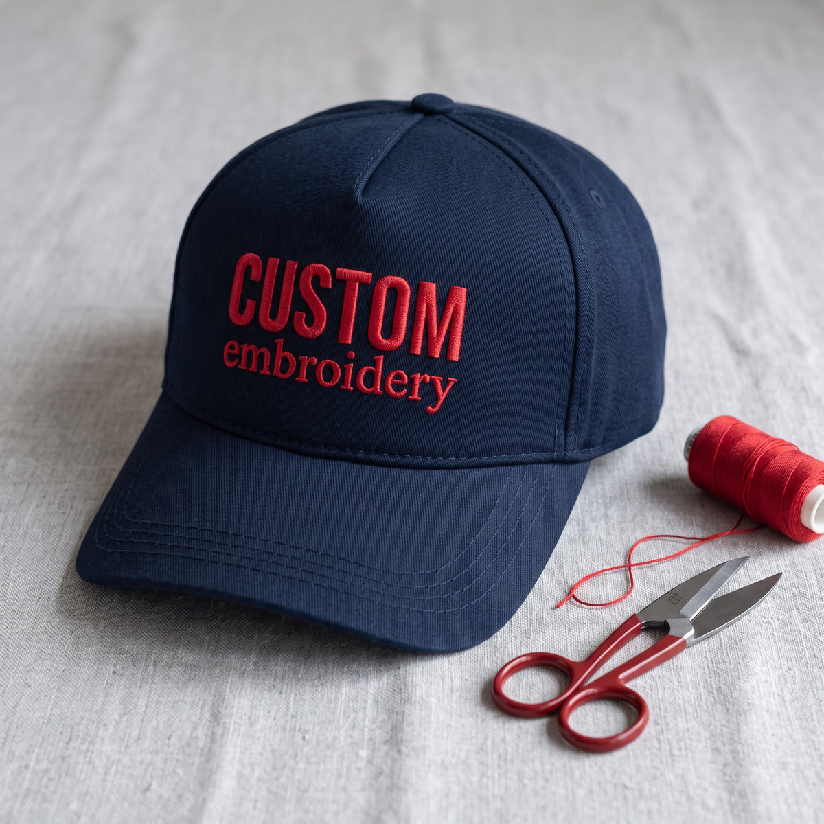 Custom Text Hat styled flat lay, embroidery detail