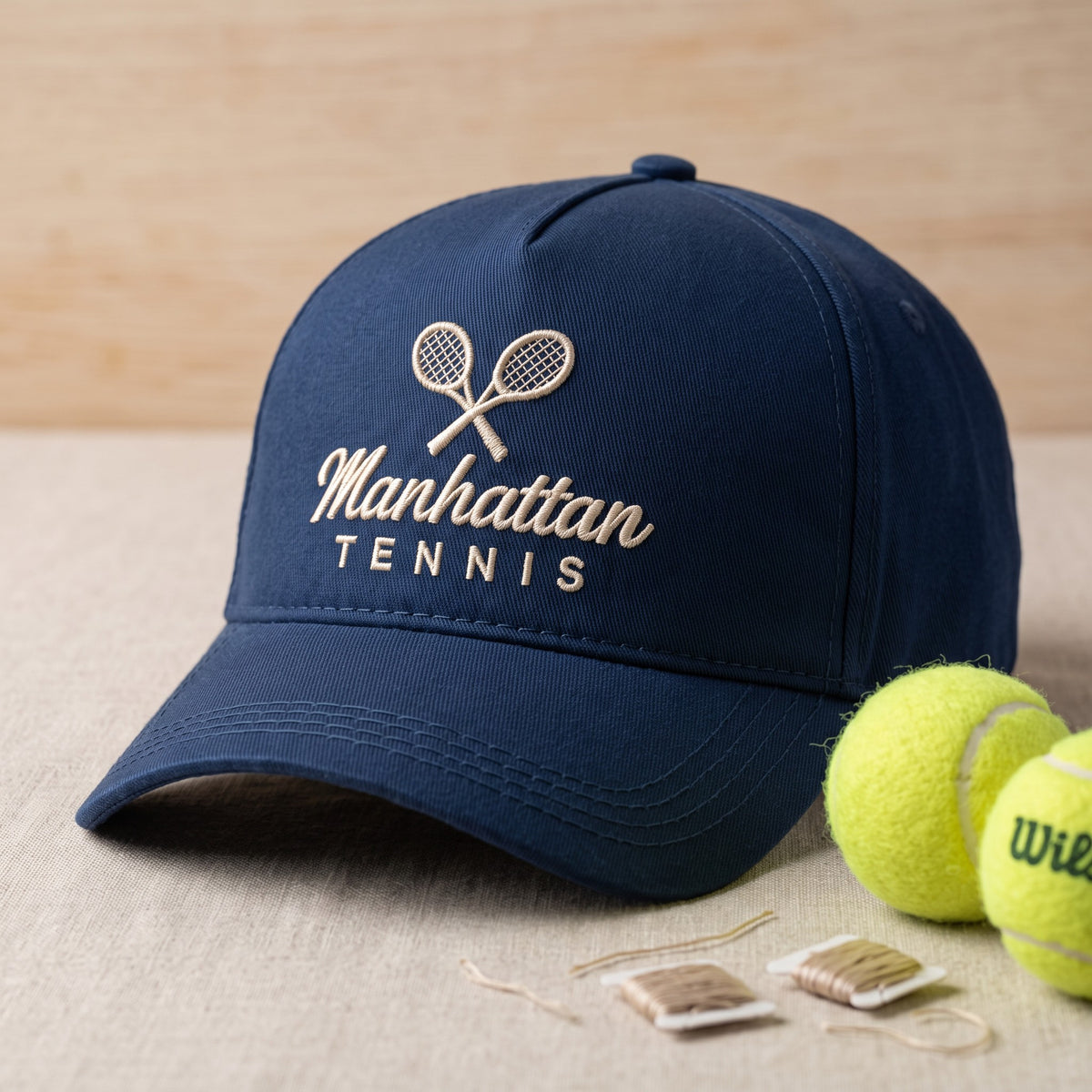 Custom Tennis Cap styled flat lay, embroidery detail