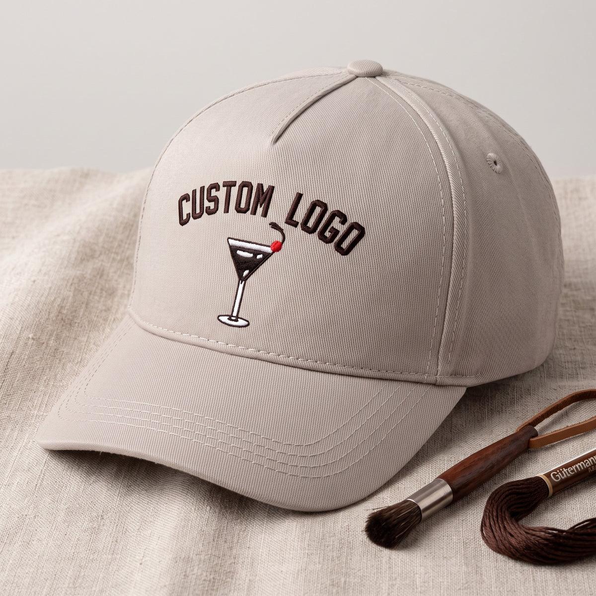 Custom Logo Hat styled flat lay, embroidery detail