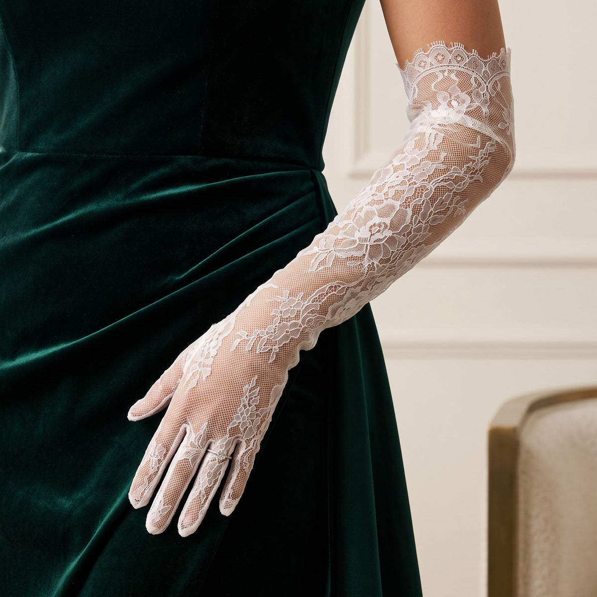 Above-elbow white Chantilly lace gloves with scalloped edges, fingers covered.