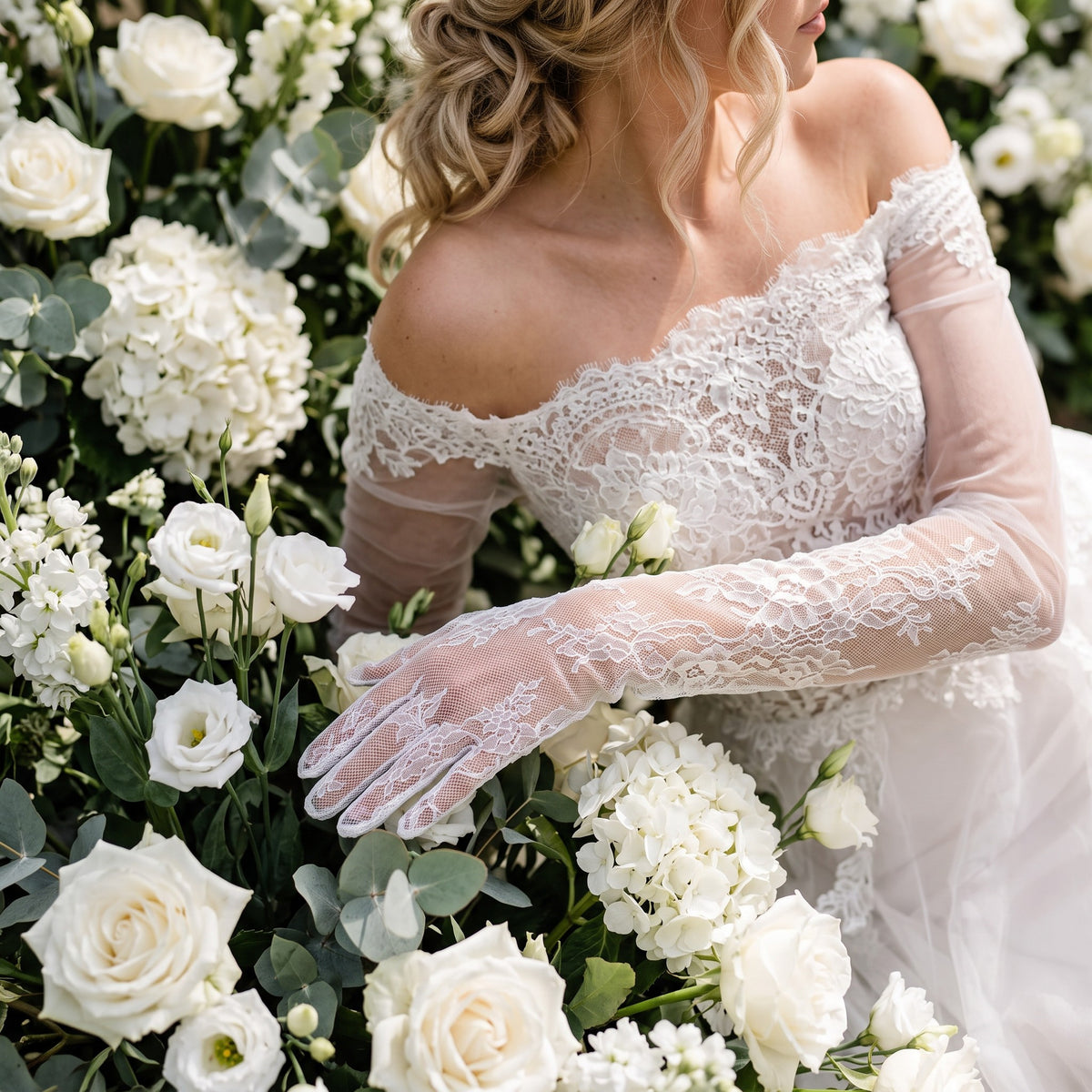 Above-elbow white Chantilly lace gloves with scalloped edges, fingers covered.
