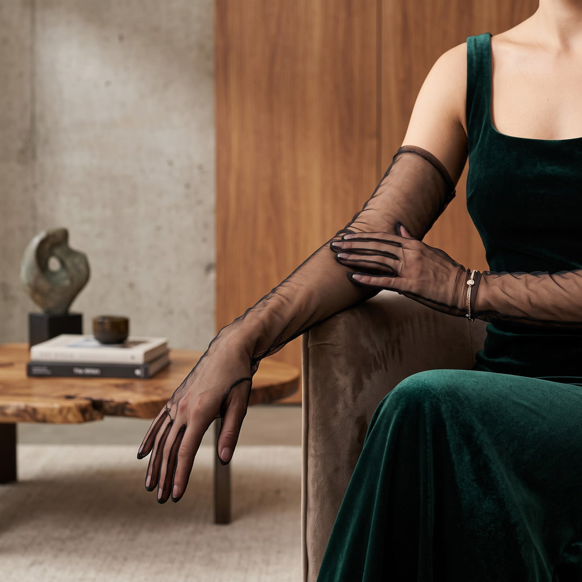 Above-elbow black sheer tulle gloves, plain and unlined, fingers covered.