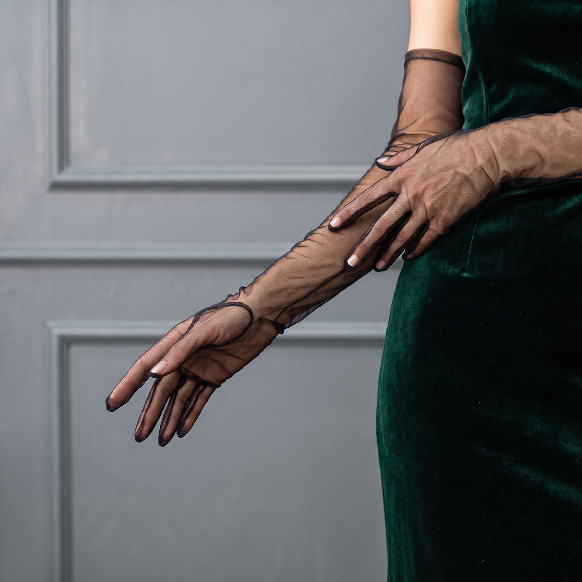 Above-elbow black sheer tulle gloves, plain and unlined, fingers covered.