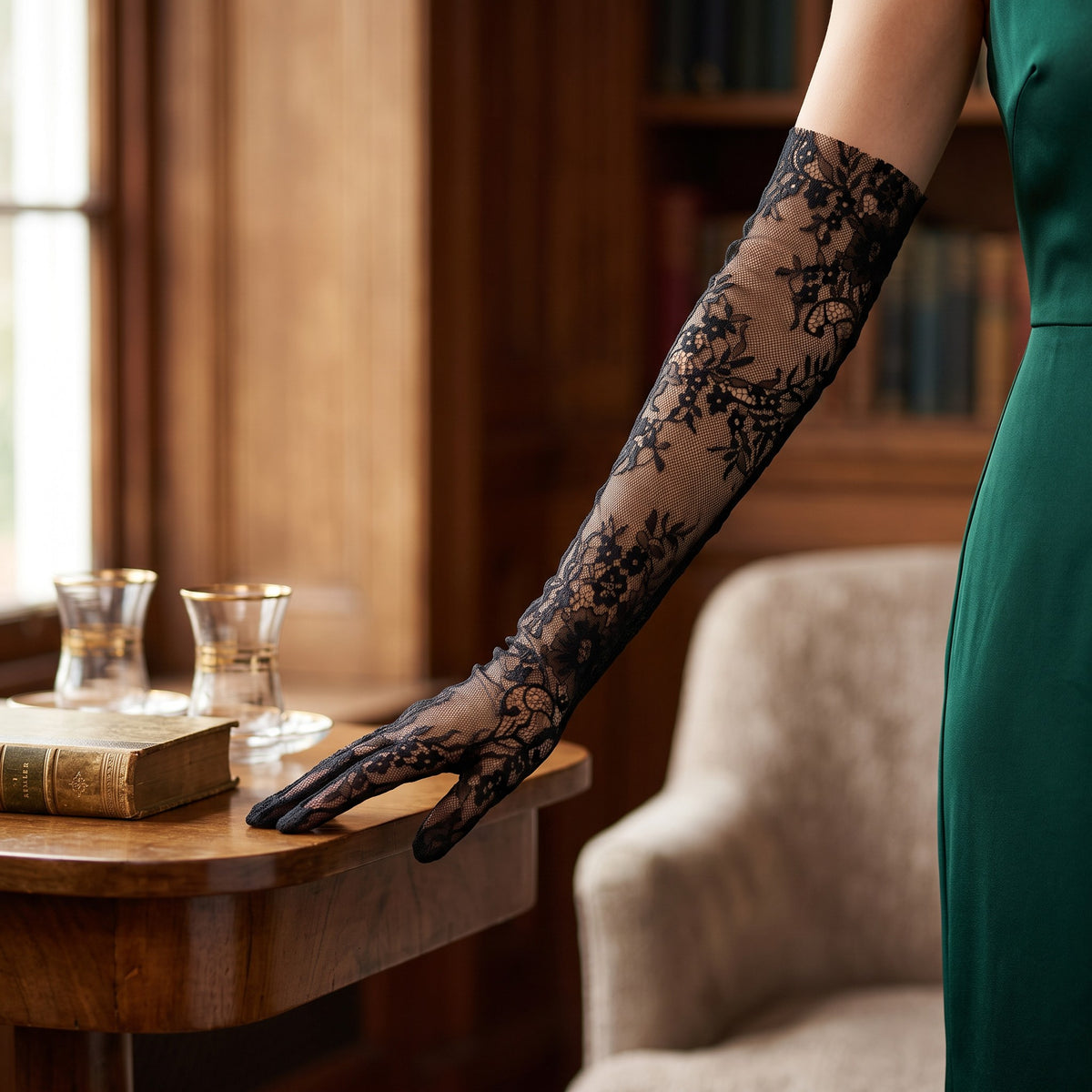 Above-elbow black floral lace gloves with scalloped fingertips.