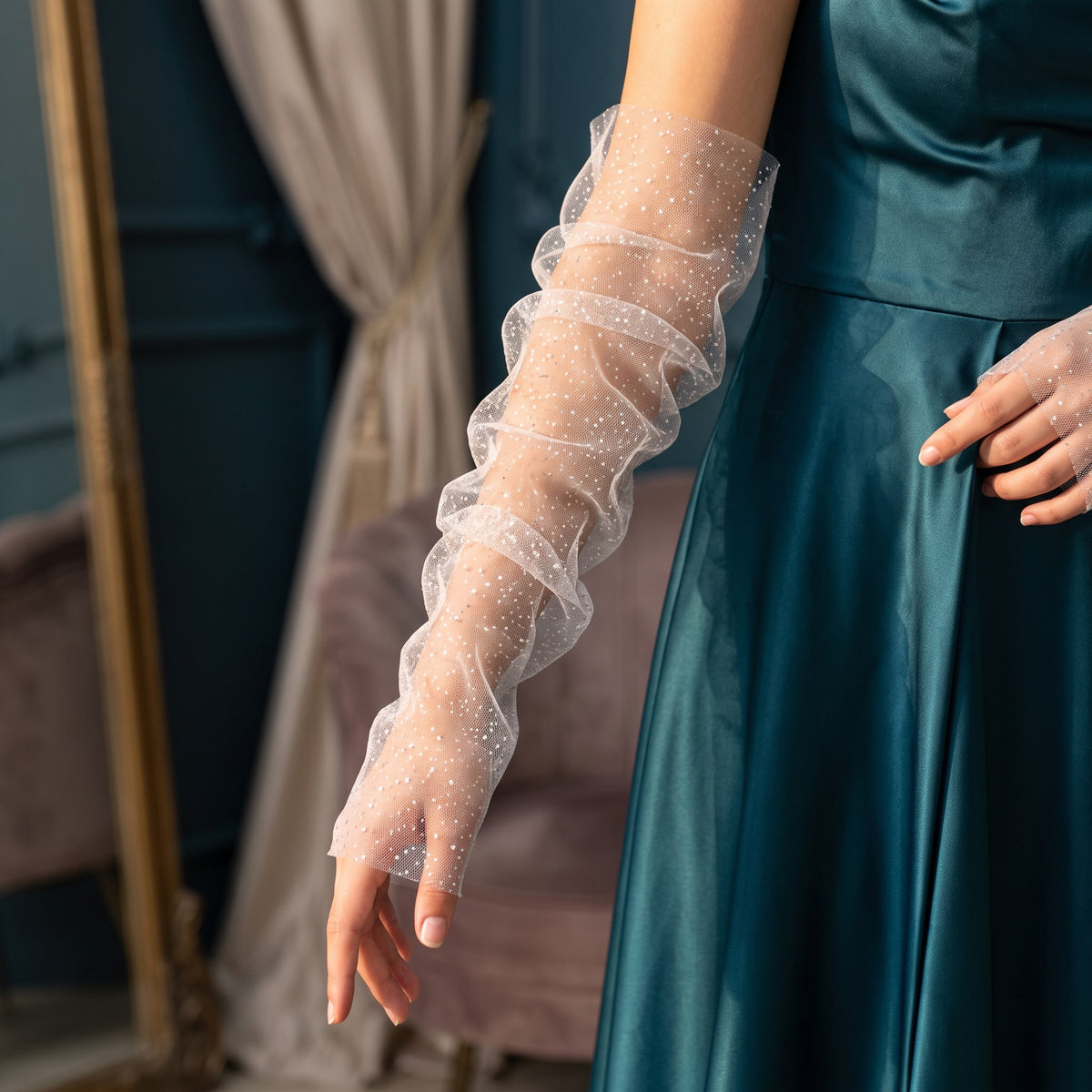 Ruched white tulle arm cuffs flecked with fine glitter, fingerless, ruffle edge.