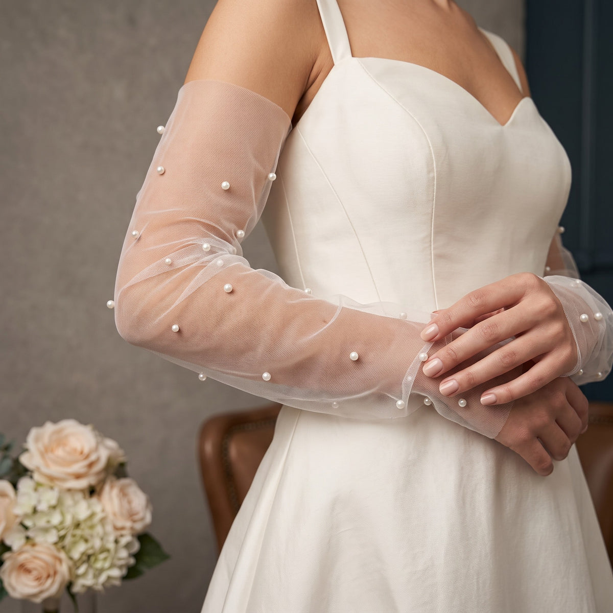 White tulle arm cuffs with small pearls scattered widely, fingerless, no ruffle.