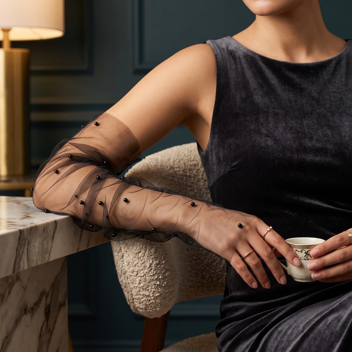 Black tulle arm cuffs scattered with black pearls, fingerless, ruched.