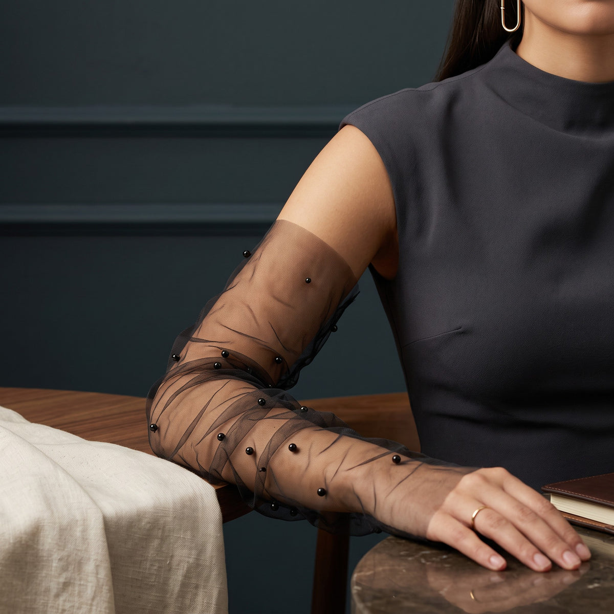 Black tulle arm cuffs scattered with black pearls, fingerless, ruched.