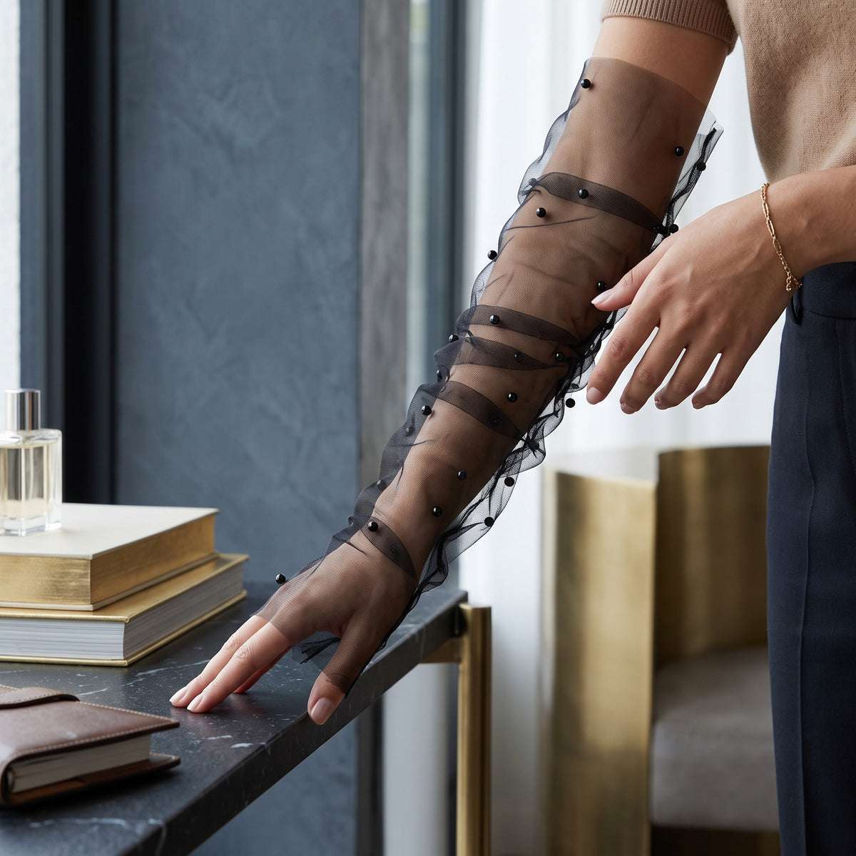 Black tulle arm cuffs scattered with black pearls, fingerless, ruched.