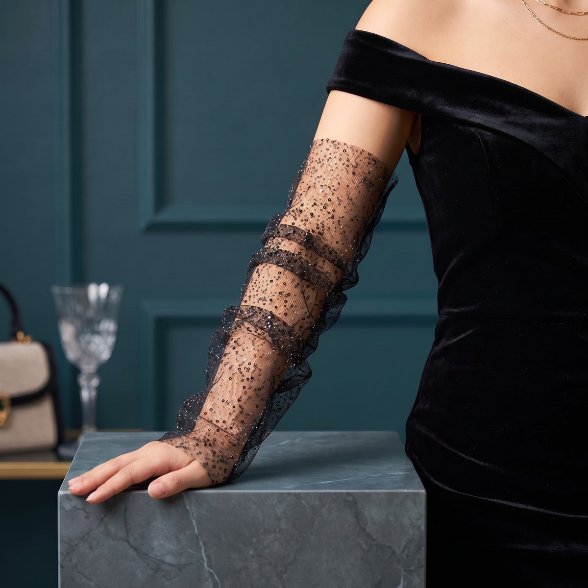 Black tulle arm cuffs sewn with small sequins, fingerless, ruffle edge.