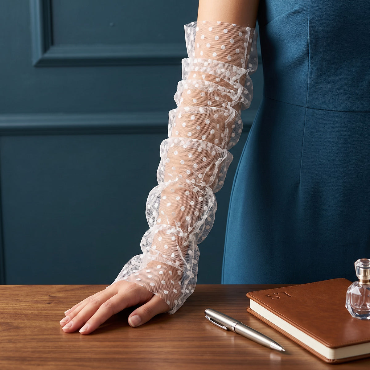 White polka dot tulle arm cuffs, fingerless, ruched with a ruffle edge.
