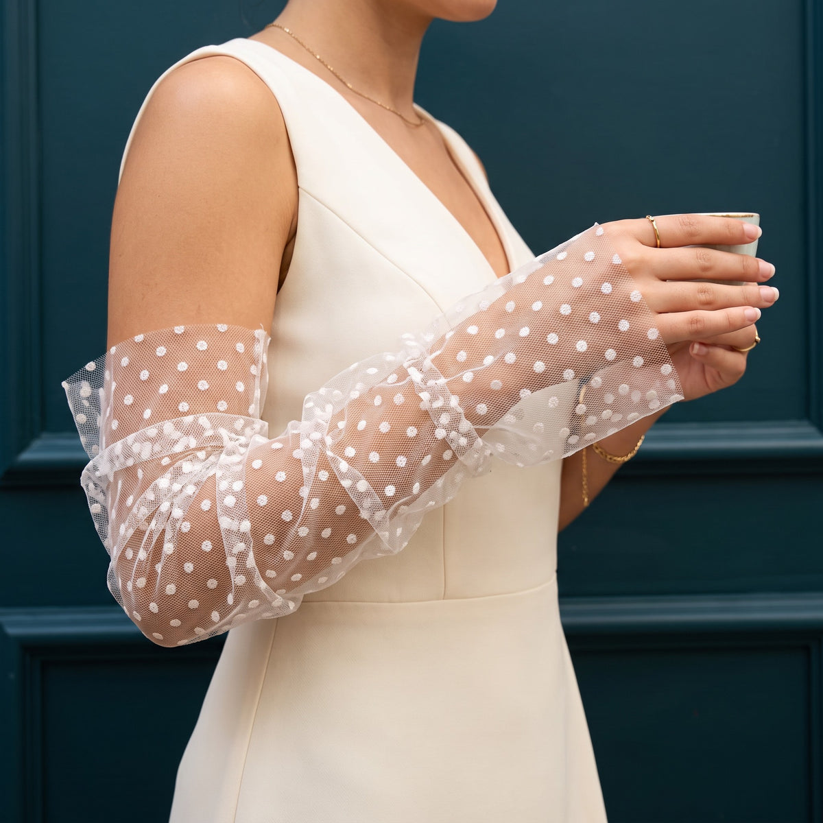 White polka dot tulle arm cuffs, fingerless, ruched with a ruffle edge.
