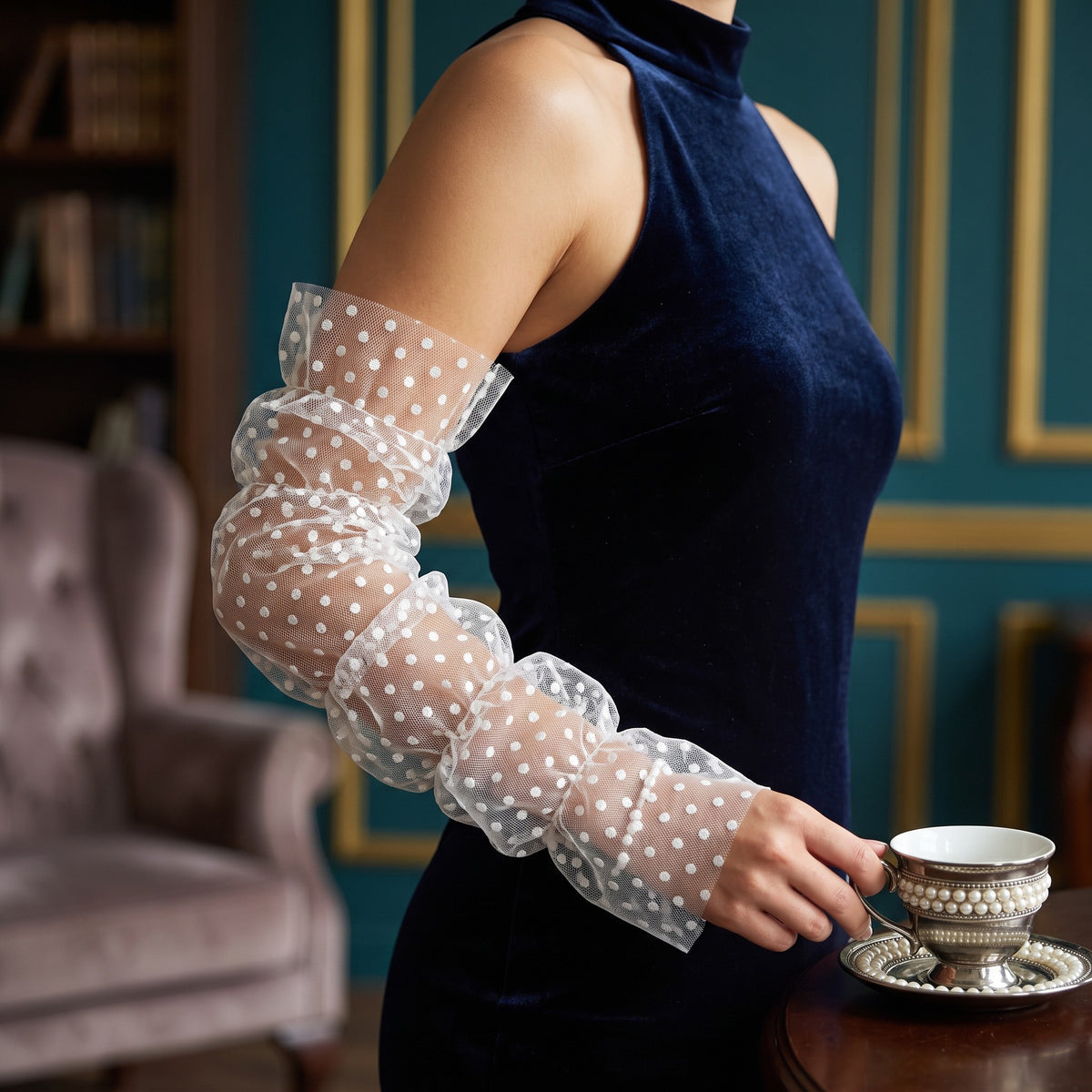 White polka dot tulle arm cuffs, fingerless, ruched with a ruffle edge.