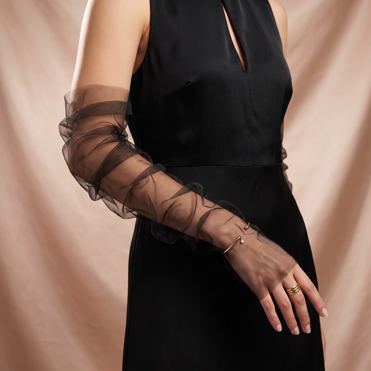 Ruched black tulle arm cuffs, fingerless, plain with a ruffle edge.