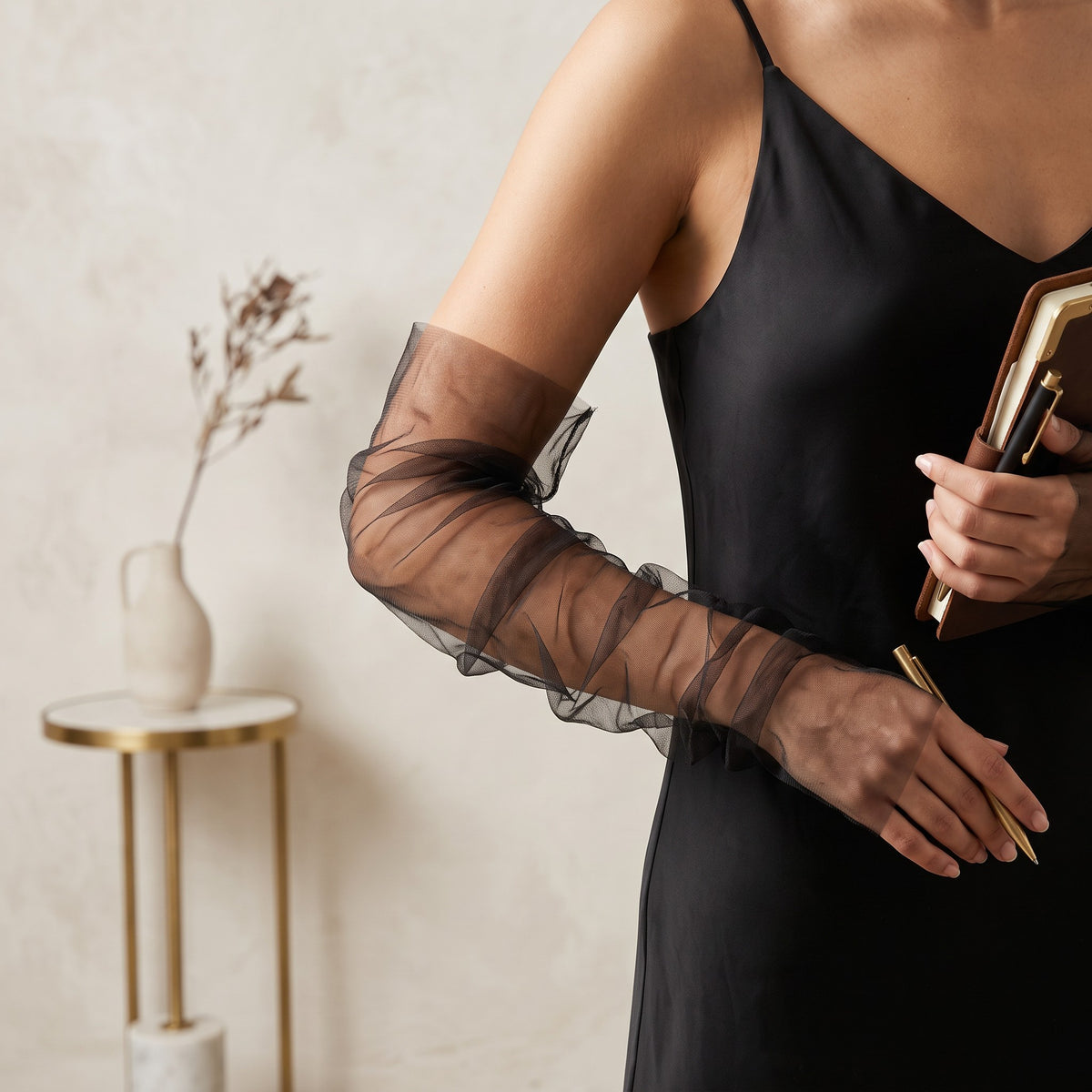 Ruched black tulle arm cuffs, fingerless, plain with a ruffle edge.
