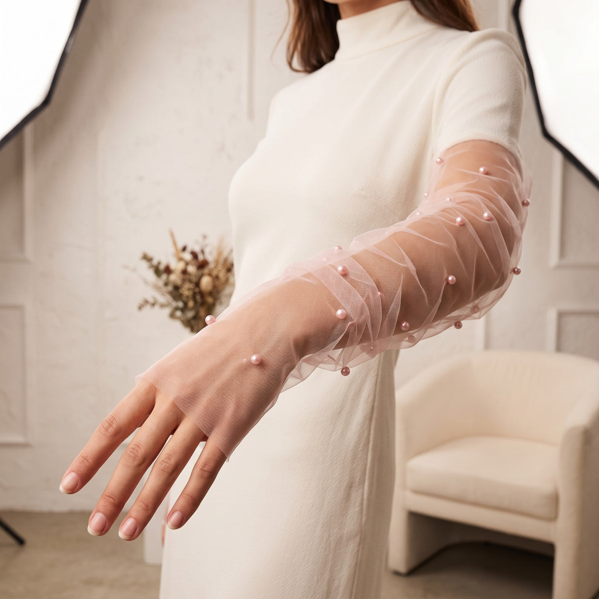 White tulle arm cuffs set with larger pearls, fingerless, densely ruched.