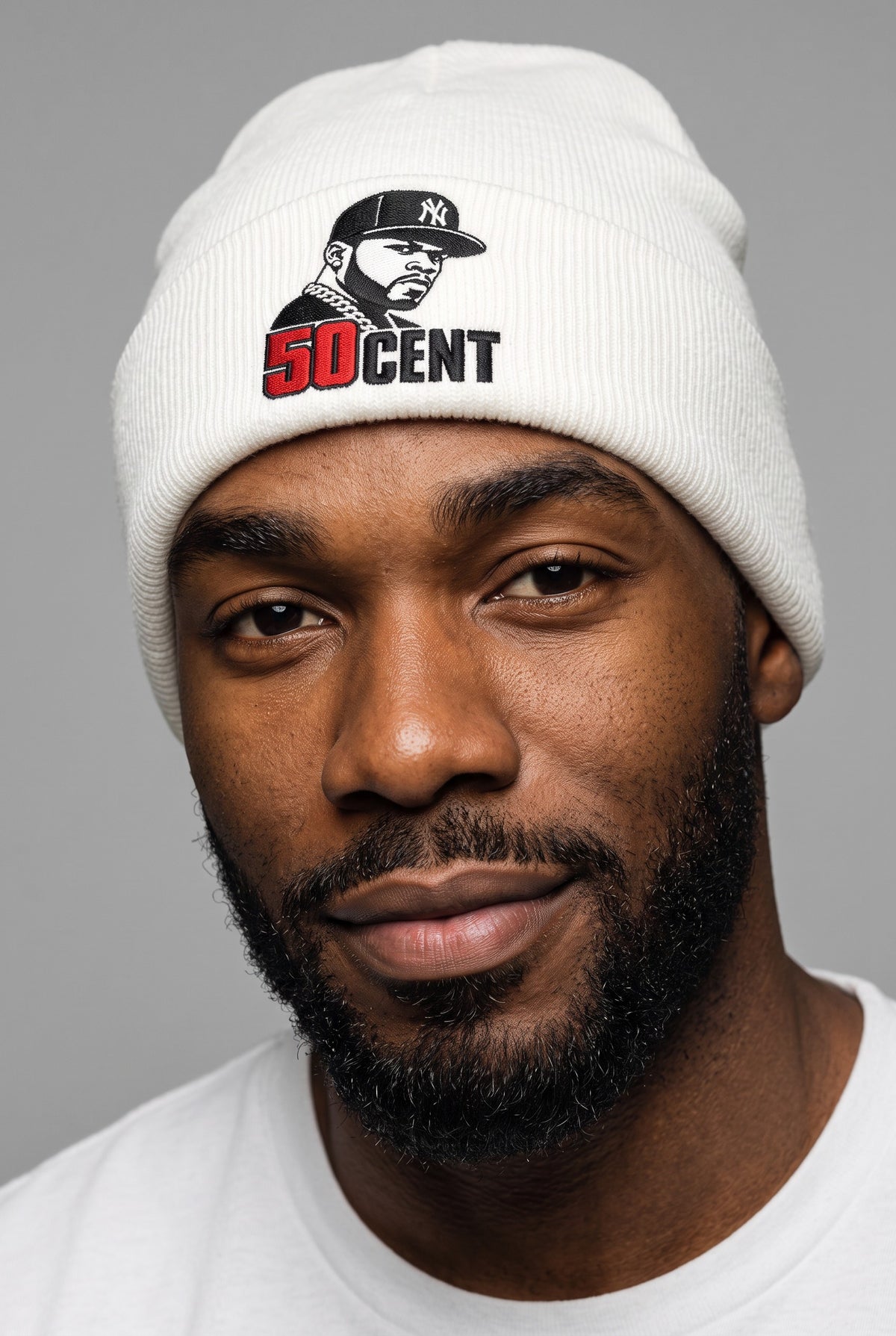 Model wearing a white Eddia beanie with custom cuff embroidery