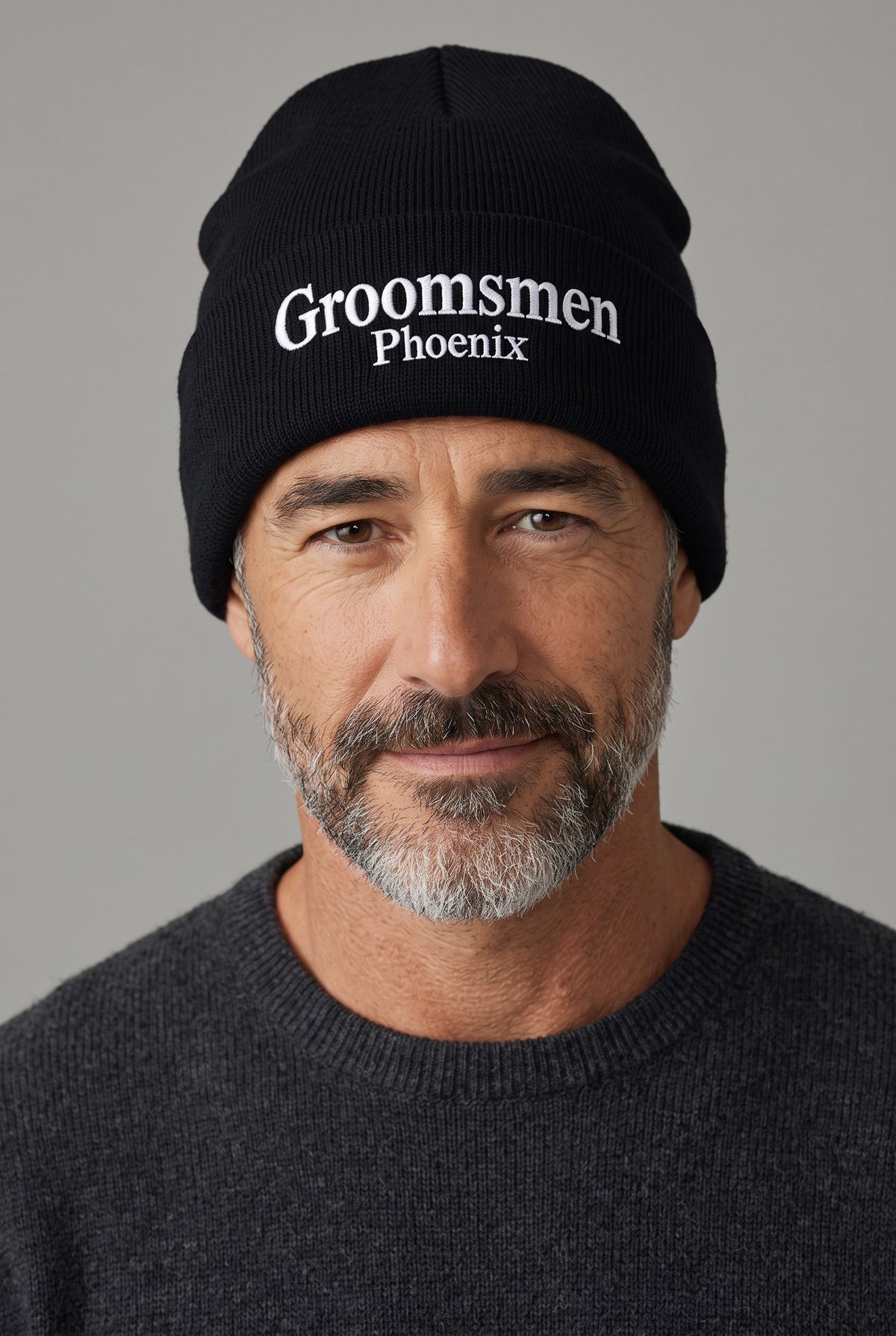 Model wearing a black Eddia beanie with custom cuff embroidery