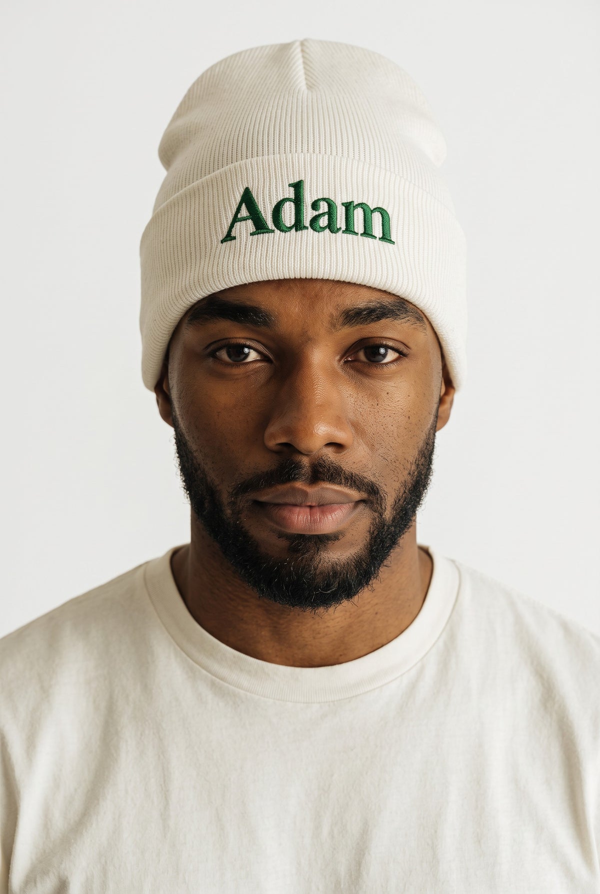 White cuffed knit beanie embroidered with a name in green thread — Eddia Socks