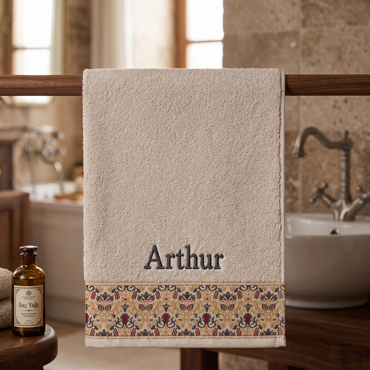 Arthur personalized hair towel, charcoal grey serif embroidery on cream cotton with a patterned border — photo 5