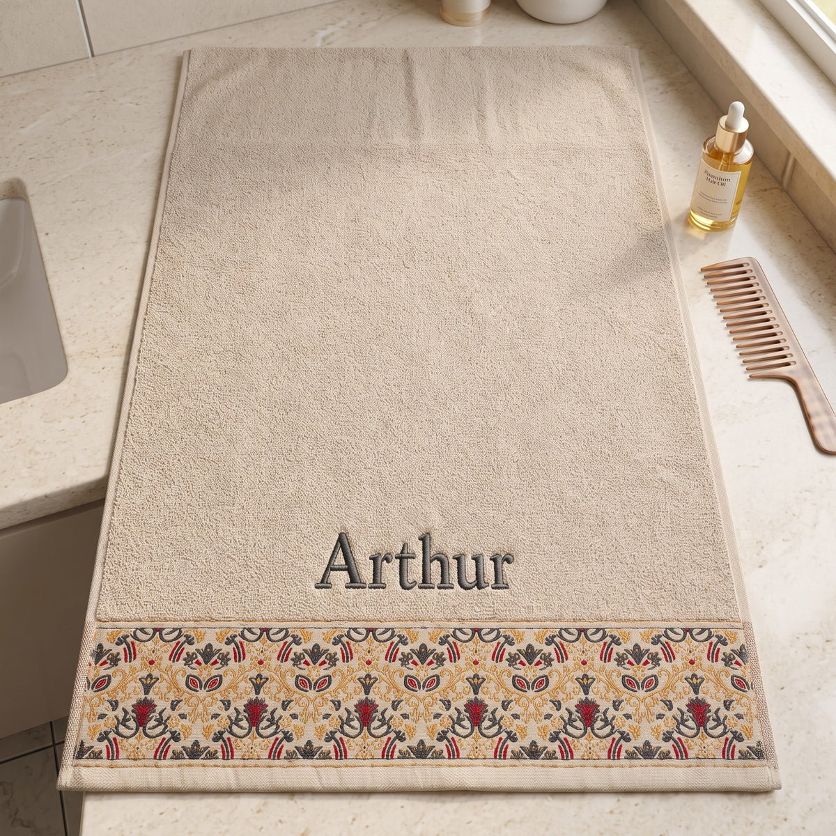 Arthur personalized hair towel, charcoal grey serif embroidery on cream cotton with a patterned border — photo 9
