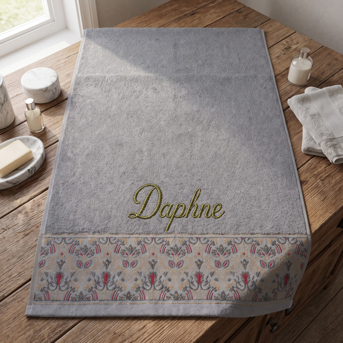 Daphne personalized hair towel, olive green script embroidery on light gray cotton with a patterned border — photo 2