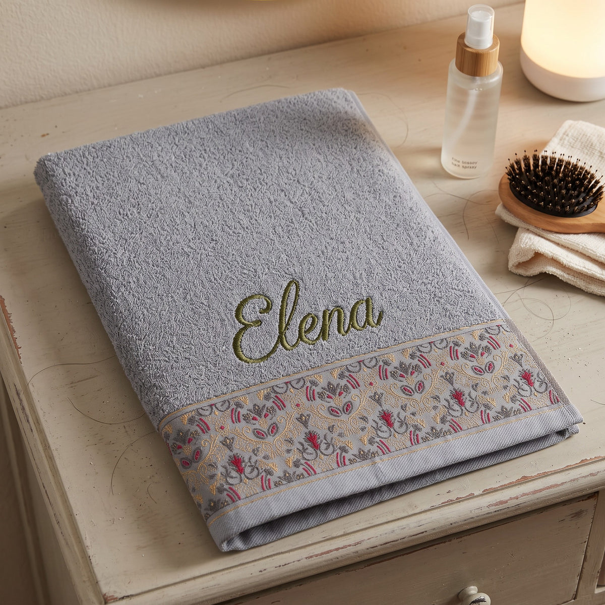 Elena personalized hair towel, olive green script embroidery on light gray cotton with a patterned border — photo 4