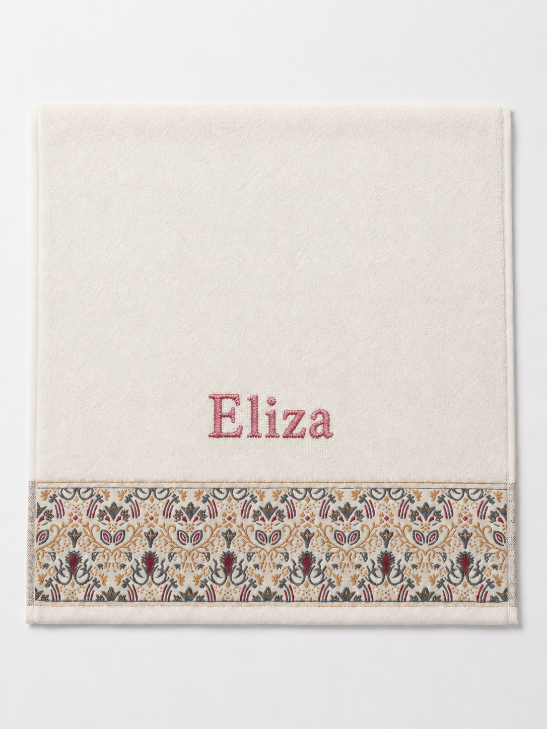Eliza personalized hair towel, rose pink serif embroidery on ivory cotton with a patterned border