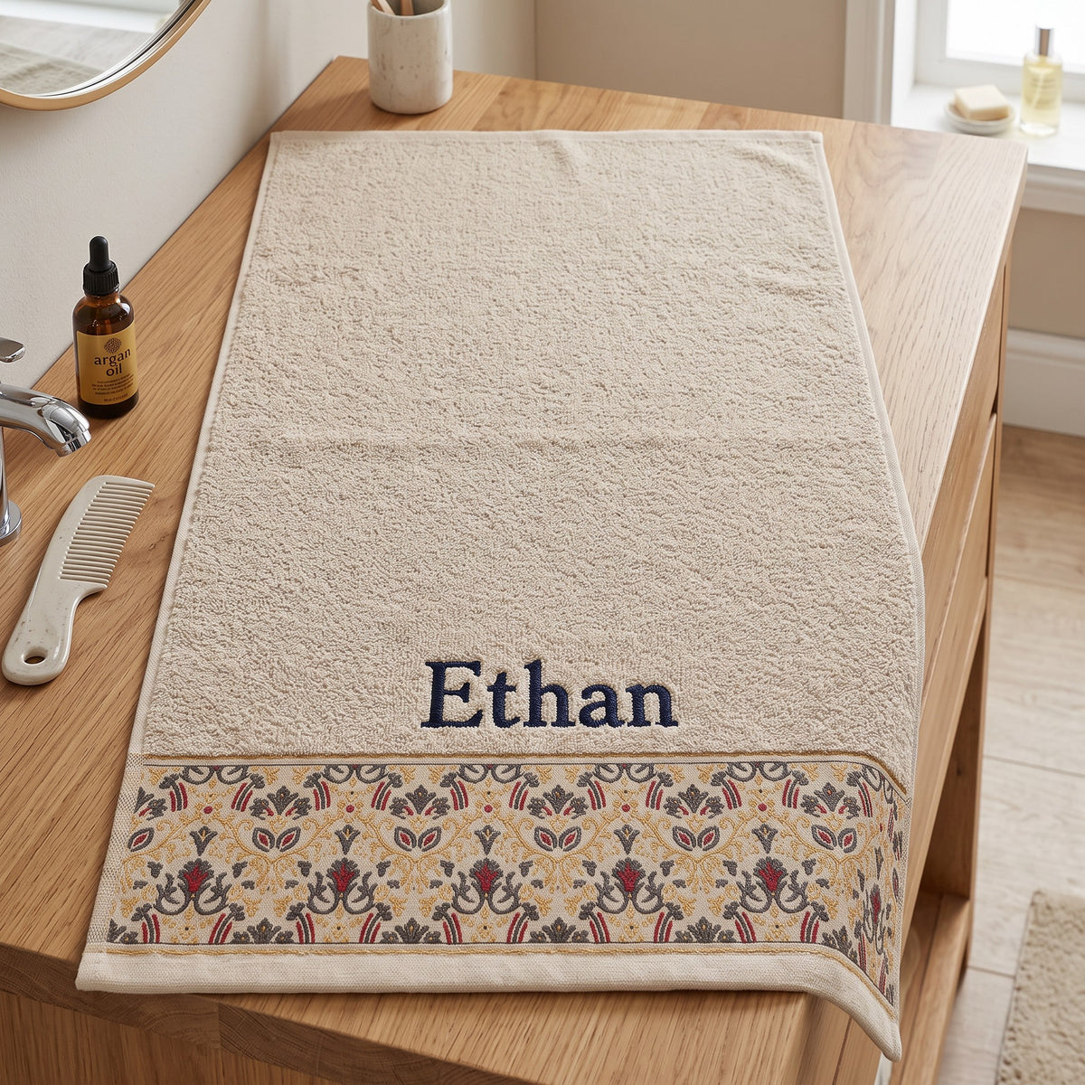 Ethan personalized hair towel, navy serif embroidery on cream cotton with a patterned border — photo 2