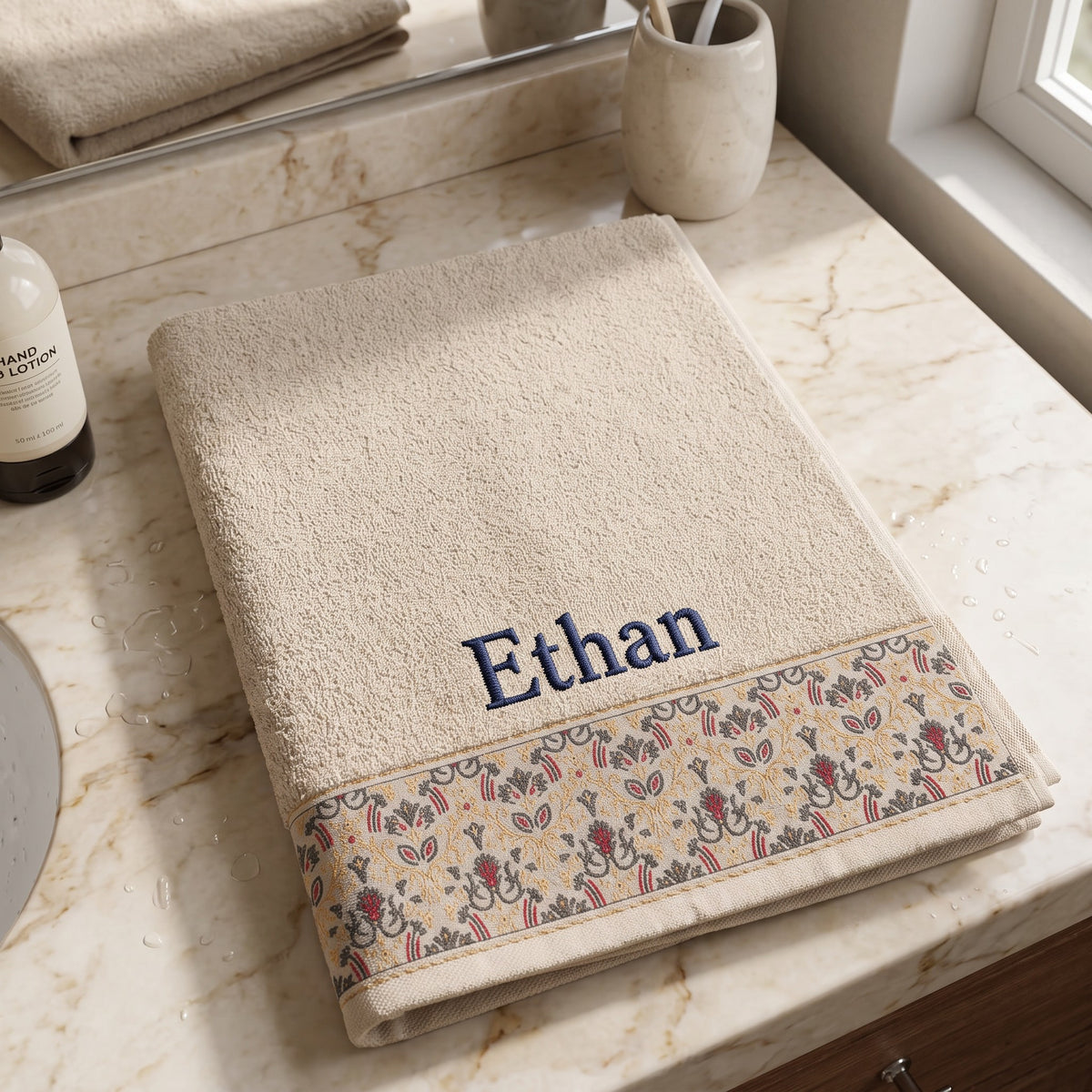 Ethan personalized hair towel, navy serif embroidery on cream cotton with a patterned border — photo 6