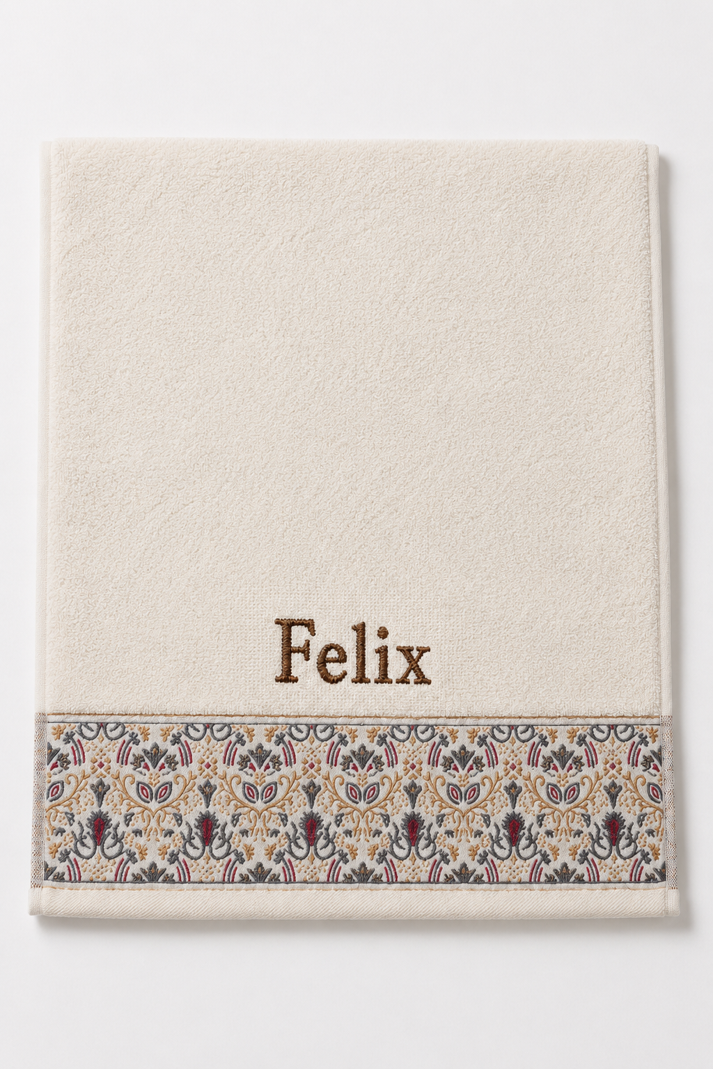 Felix personalized hair towel, brown serif embroidery on ivory cotton with a patterned border