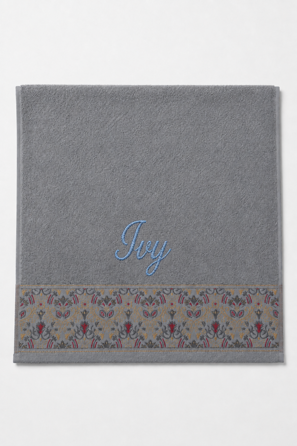 Ivy personalized hair towel, light blue script embroidery on light gray cotton with a patterned border