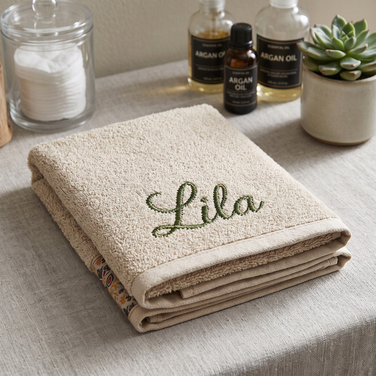Lila personalized hair towel, olive green script embroidery on cream cotton with a patterned border — photo 3
