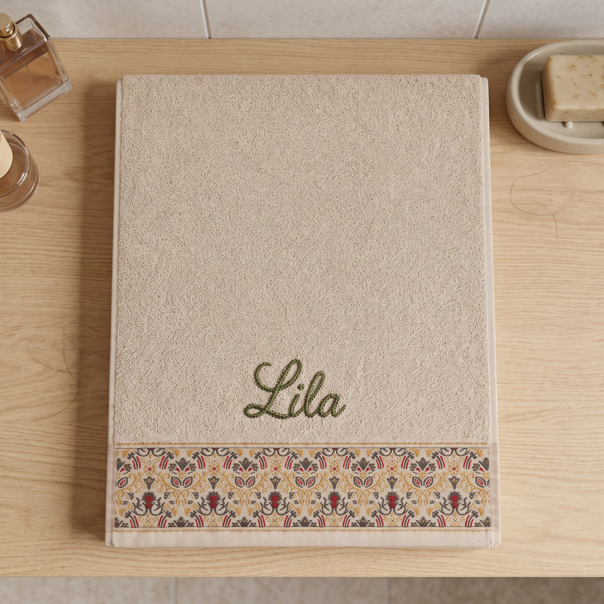 Lila personalized hair towel, olive green script embroidery on cream cotton with a patterned border — photo 6