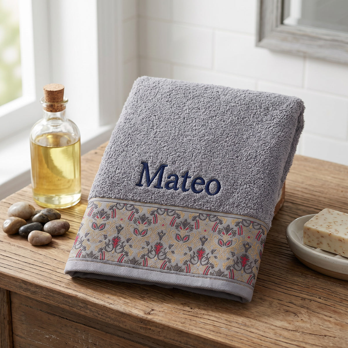 Mateo personalized hair towel, navy serif embroidery on light gray cotton with a patterned border — photo 4